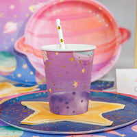 galaxy paper cup on space themed table with star napkin and straw