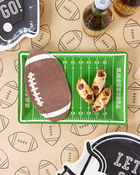 Football runner under a field-print tray with pigs in a blankets and a football napkin