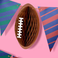 Accordion pop-up football decoration attached to game day banner
