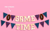 Pre-strung gold foil game day banner with football accordion and pennant flags