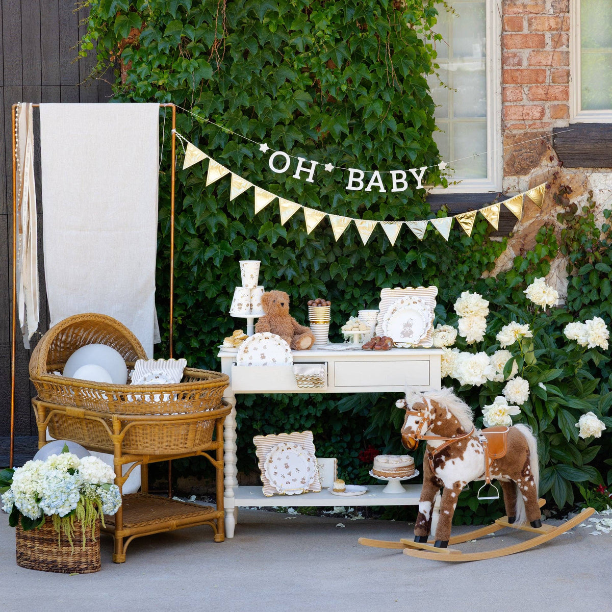 Outdoor baby shower setup featuring teddy bear party cups