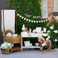 Outdoor baby shower setup featuring teddy bear party cups