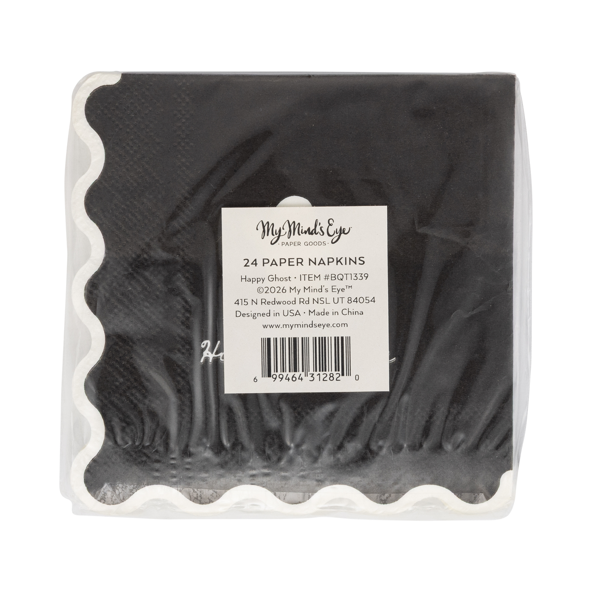 Back view of a black paper napkins in a package with a label on a white background. 