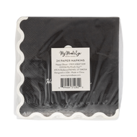 Back view of a black paper napkins in a package with a label on a white background. 