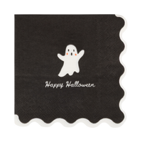 Close-up of the cream ghost design and wavy cream edge against the black paper.