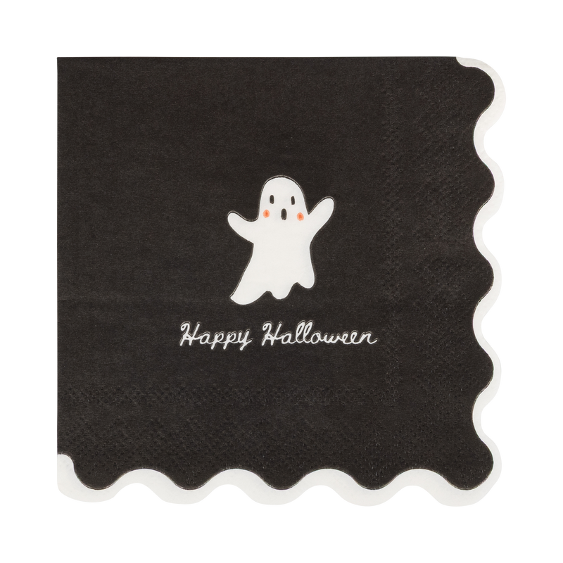Close-up of the cream ghost design and wavy cream edge against the black paper.
