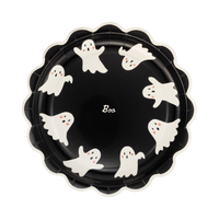 Scalloped black paper plate with cream ghosts spelling "BOO," front view.