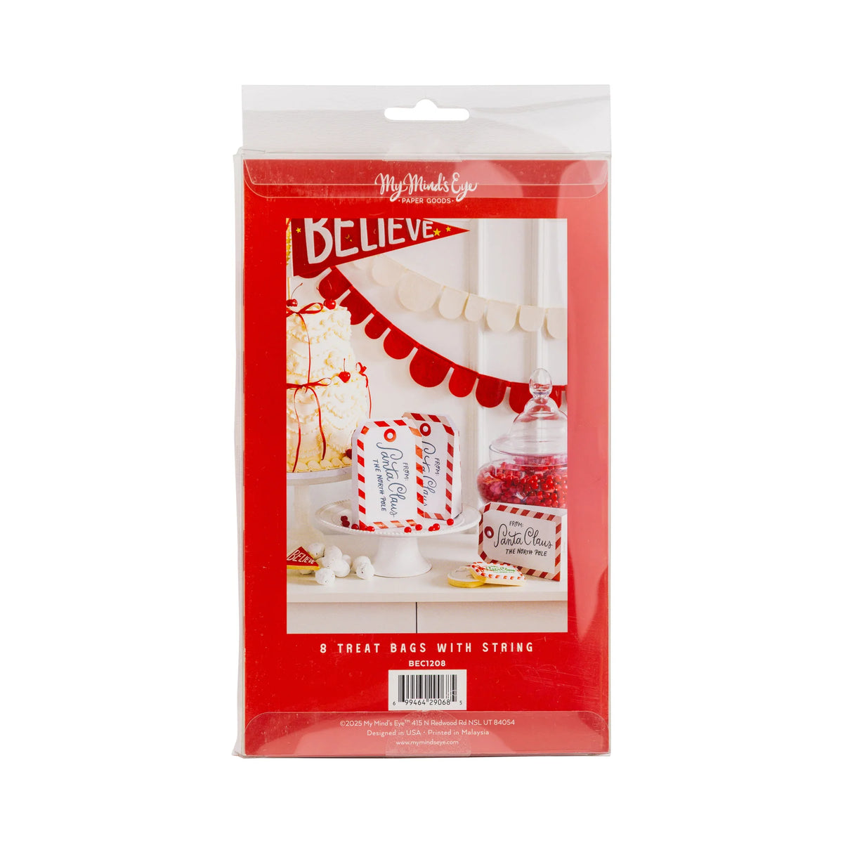 Retail pack showing tag-shaped Christmas treat boxes bags styled on a red and white dessert table