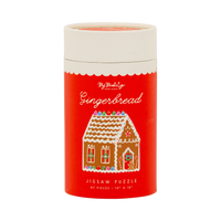 Red gingerbread jigsaw puzzle tube with gingerbread house illustration