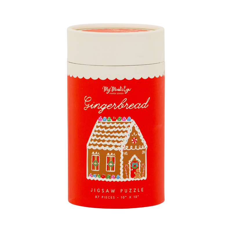 Red gingerbread jigsaw puzzle tube with gingerbread house illustration