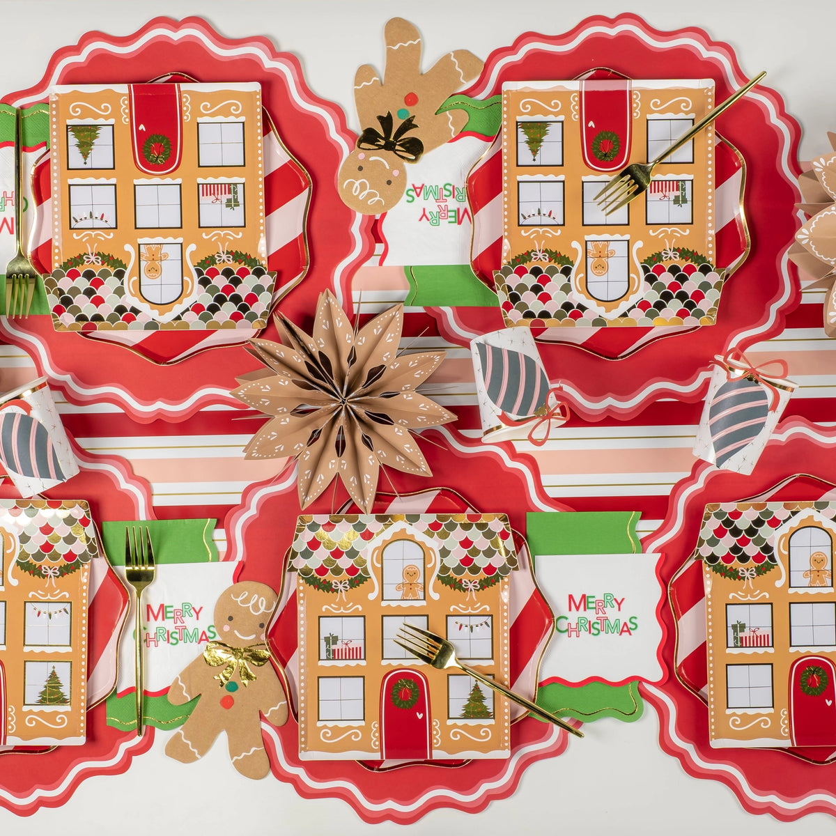 Runner view: multiple gingerbread place settings with red scallop chargers