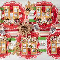 Runner view: multiple gingerbread place settings with red scallop chargers