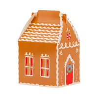 Gingerbread house treat box with icing roof, red-curtained windows, and wreath on the door