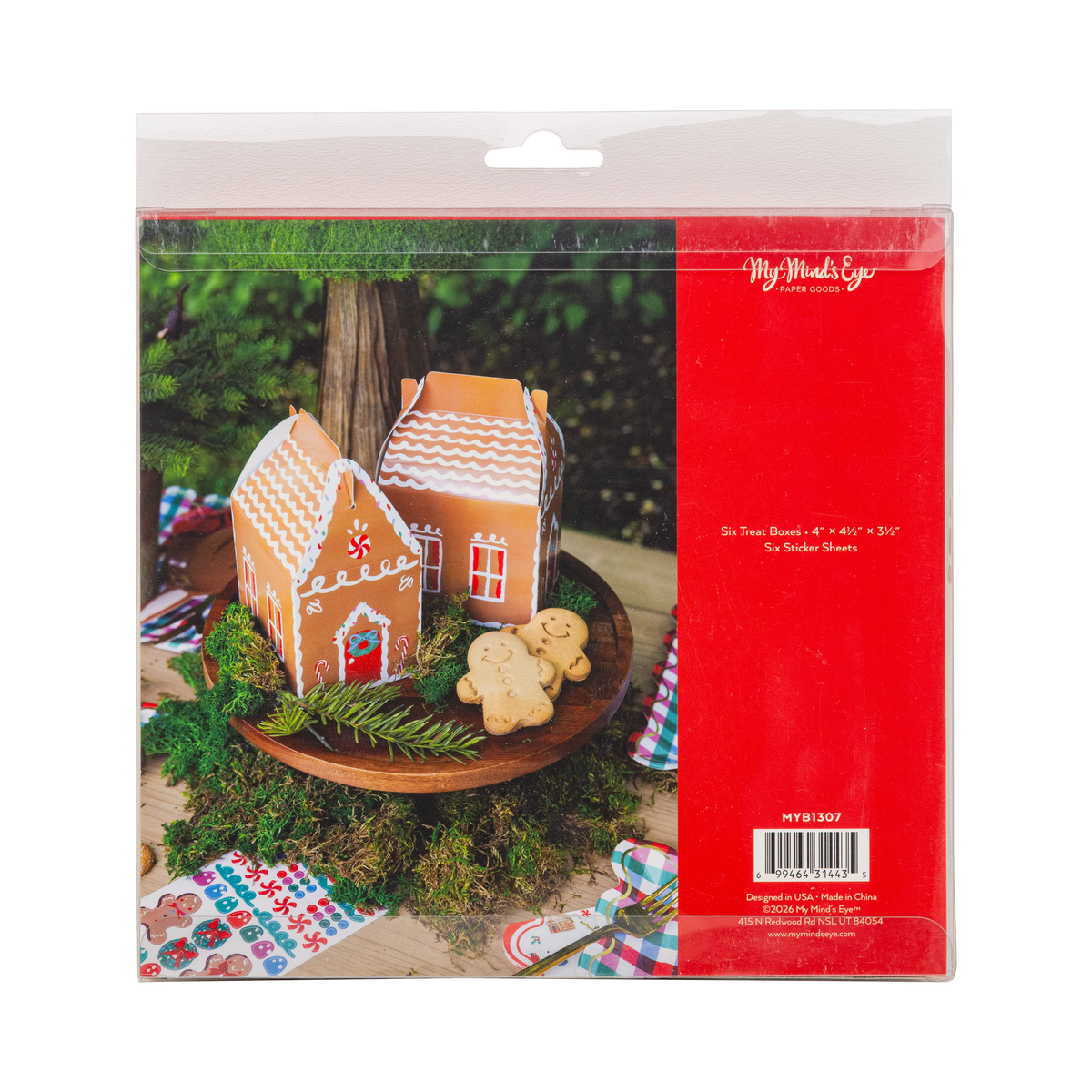 Back of gingerbread house treat box package showing 2 boxes on a cake stand with gingerbread cookies