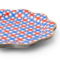 stack of red white blue gingham paper plates showing scalloped gold edge.