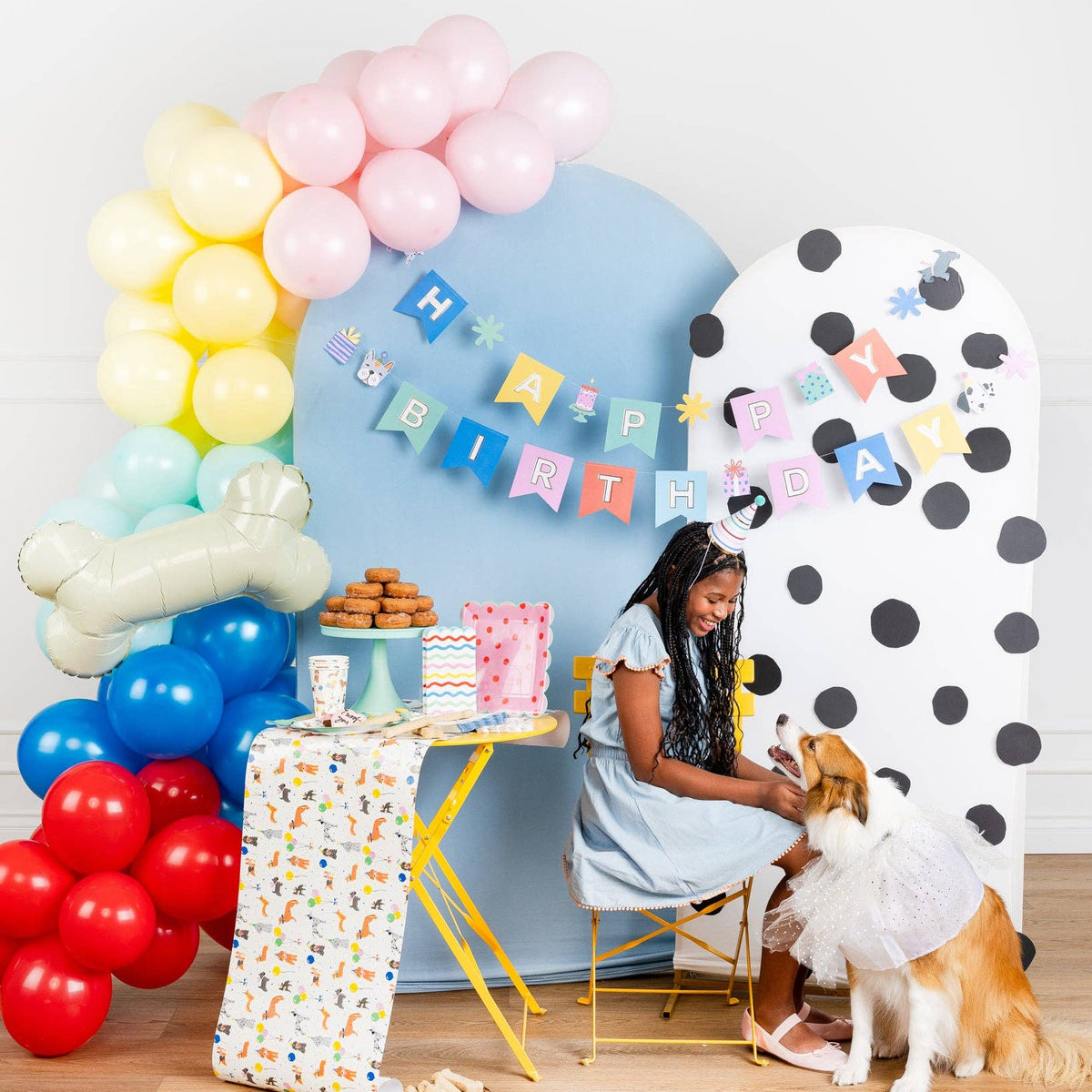 Girl and dog at puppy pawty using Dog Party Table Runner