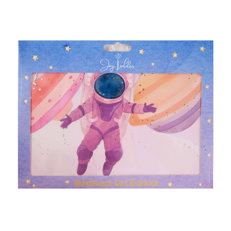 Girl astronaut space banner in Joy Ladder packaging showing the pink astronaut and pastel planets through the window.