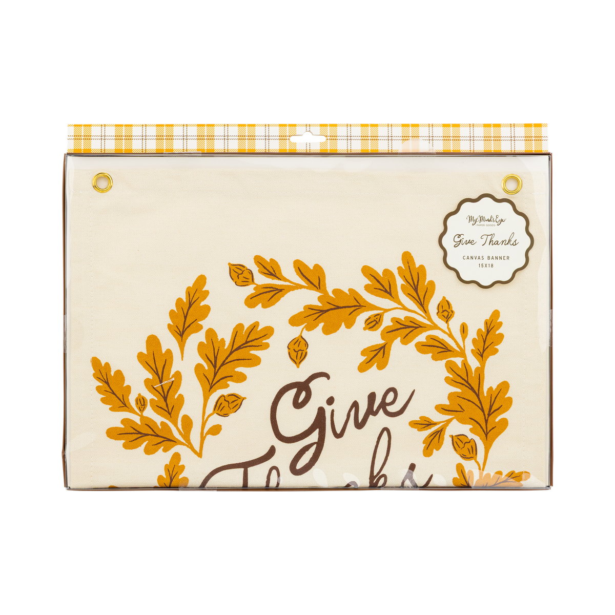 Front packaging view of the folded Give Thanks canvas banner secured inside clear plastic with a yellow plaid header card.