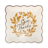 Decorative plate with 'Give Thanks' text and leaf design on a clear cover.