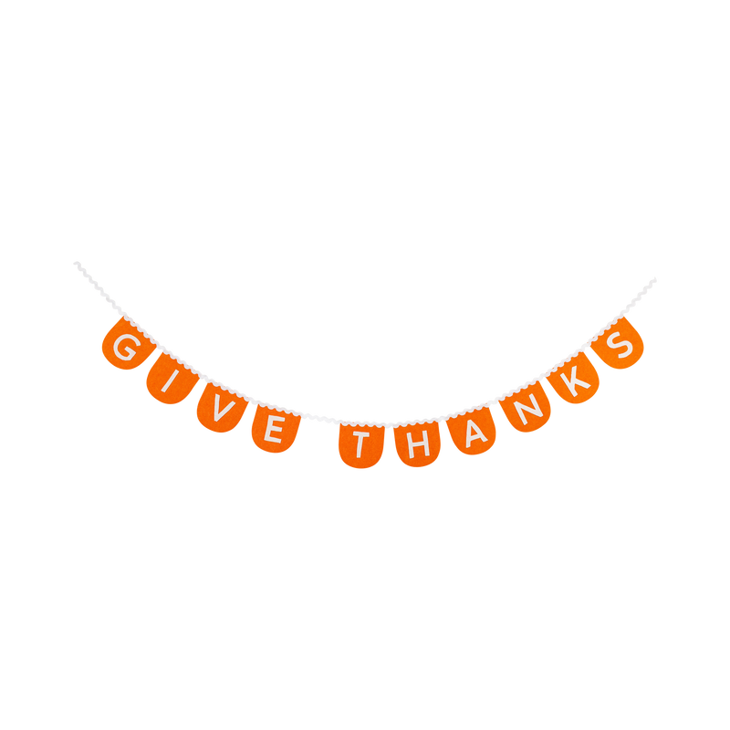 Orange scalloped felt banner spelling Give Thanks with cream letters against a clean white background.