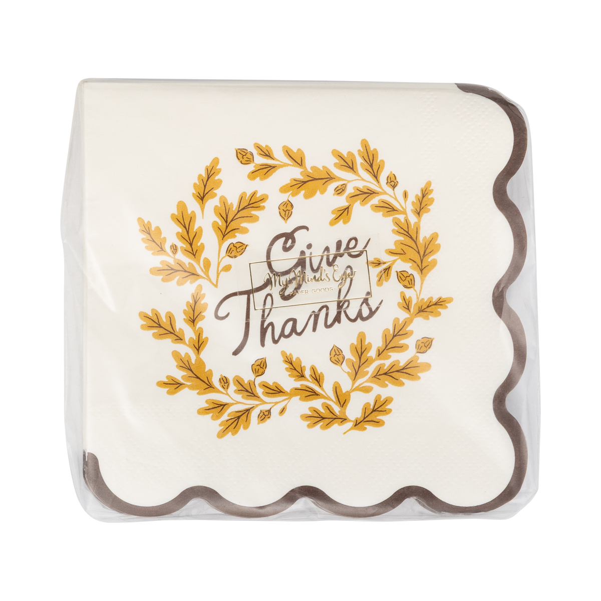 Decorative paper napkin with 'Give Thanks' text and gold leaf design on a clear cover.