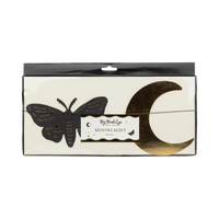 Front product packaging of the My Mind's Eye Moonlight Moths and Stars sewn banner with a clear display window highlighting the gold foil crescent moon and moth cutouts.