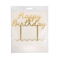 Front of My Mind's Eye gold Happy Birthday acrylic cake topper in clear retail packaging showing mirror gold script lettering and scalloped card detail