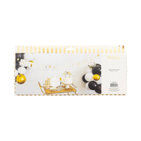 Back of My Mind's Eye gold Happy Birthday banner retail packaging showing full lifestyle party setup with black white and gold balloon garland