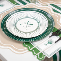 Golf party table setting with green plates and striped runner