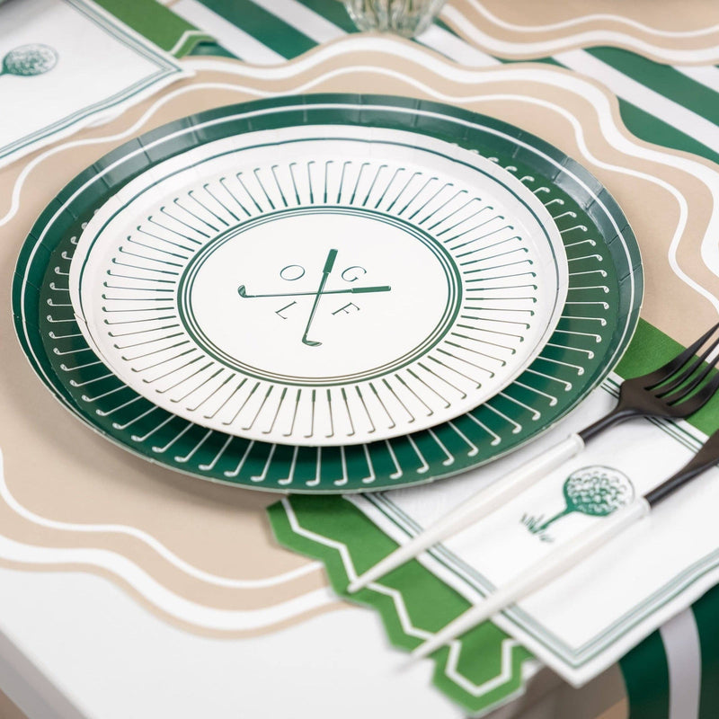 Golf party table setting with green plates and striped runner