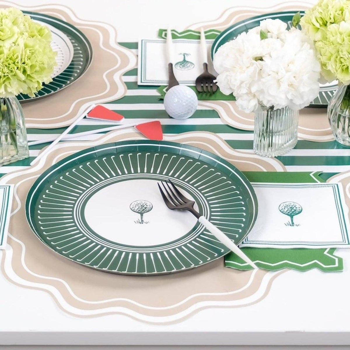 Golf party table with dark green party supplies