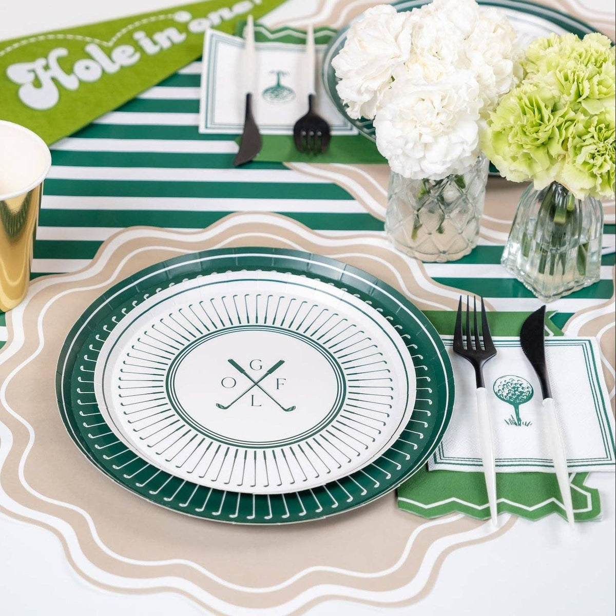 Golf table setup with dessert plates and coordinated napkins