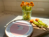 Goose paper plate with fresh grapes and carrots