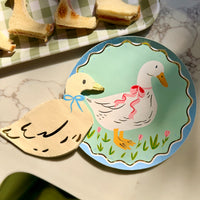 Goose themed paper plate and cocktail napkins.