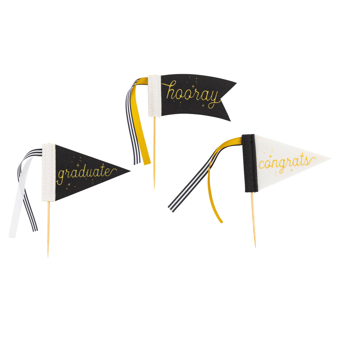 Black and cream graduation pennant cake toppers with gold lettering and ribbon accents
