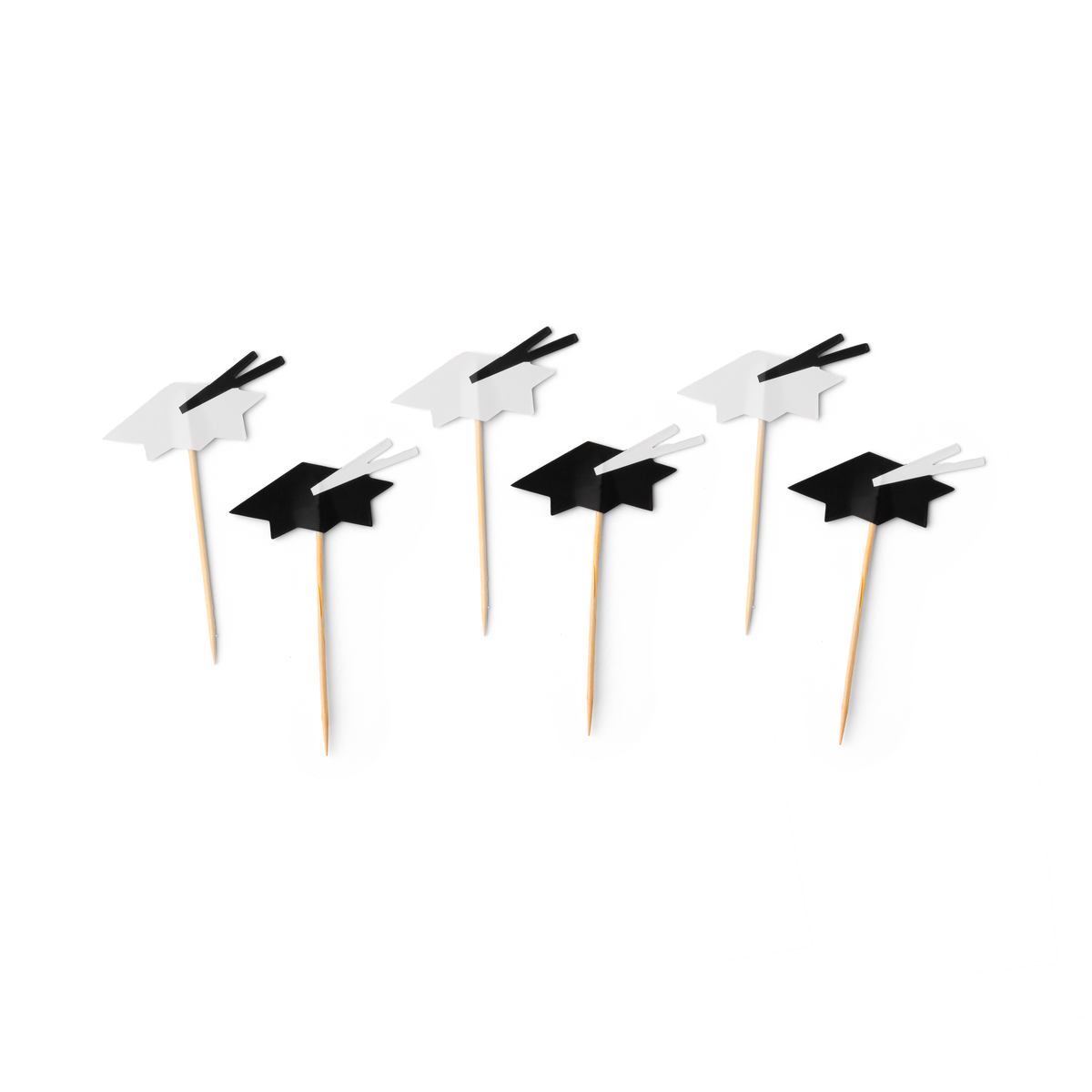 Graduation cap cupcake toppers in black and white on wooden picks
