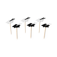 Graduation cap cupcake toppers in black and white on wooden picks
