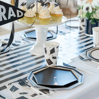 Graduation dessert table with cupcakes and black hexagon plates