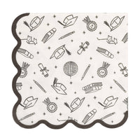 Graduation cocktail napkin with black border showing caps, diplomas, and ribbon icons