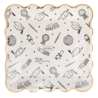 Graduation icon foil plate in packaging with black graduation icons and gold foil edge