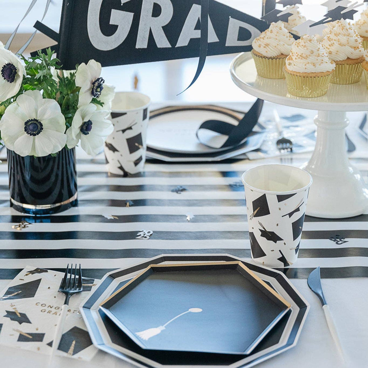 Graduation party table featuring black and white graduation tableware