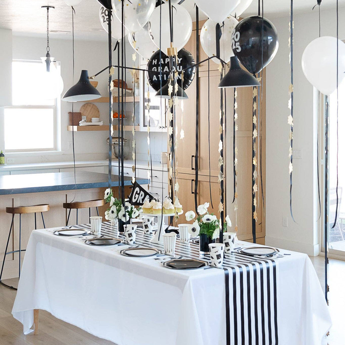 Graduation party table with black graduation balloon