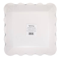 Back view of black graduation plate with scalloped edges and packaging label