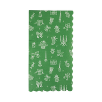 Green Christmas dinner napkin with a happy icon pattern and scalloped edges