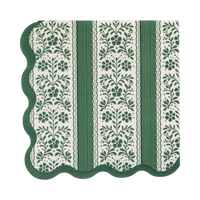 Folded green and cream floral stripe paper cocktail napkin with a wavy green edge on a white background