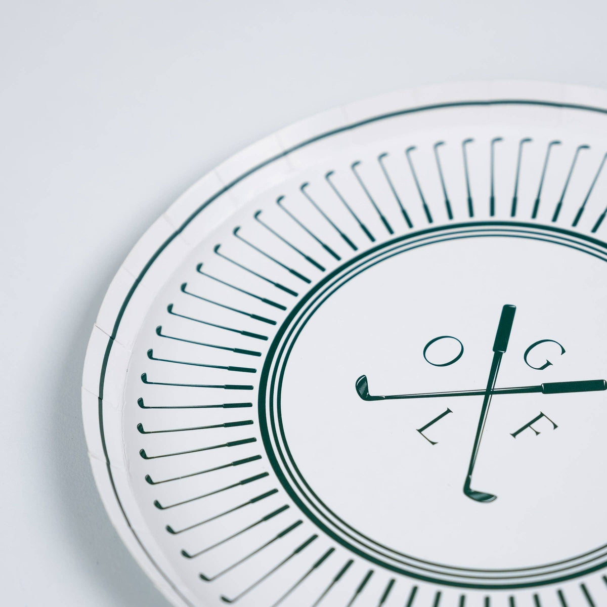 Close-up of green golf club border detail on paper plate