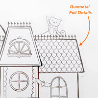 Close up detail showing the gunmetal foil outlines on the scalloped roof of the haunted house paper placemat.