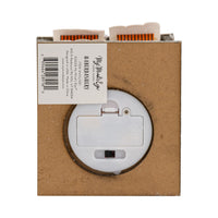 Battery compartment on the underside of the Haberdashery village house showing on/off switch; requires 2 AAA batteries.