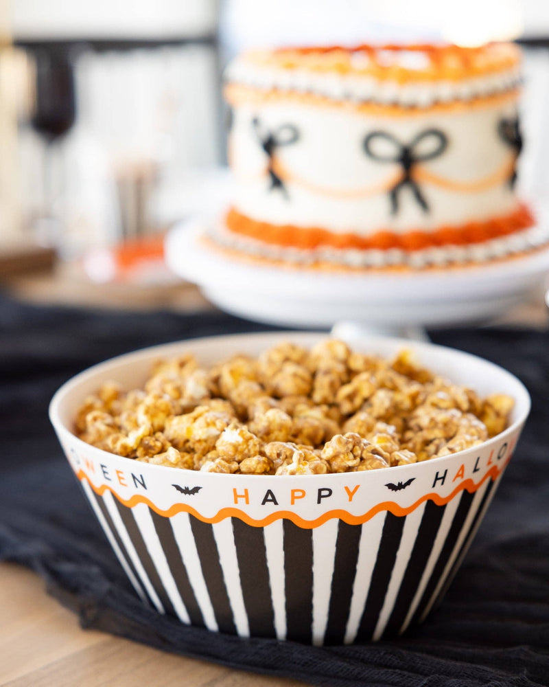 Reusable Halloween bamboo bowl filled with caramelized popcorn for a Halloween party.