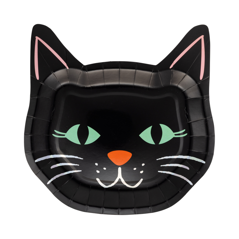Die-cut black cat face shaped Halloween paper plate with green eyes, orange nose, pink inner ears, whiskers, and holographic foil accents, front view on gray background.